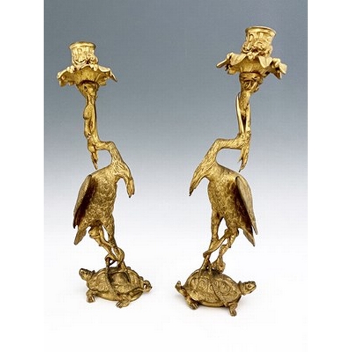 246 - A pair of George IV gilt bronze ormolu figural candlesticks, circa 1830, modelled as herons with fis... 