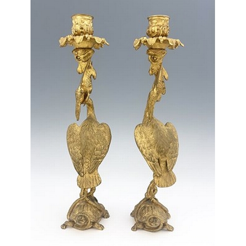 246 - A pair of George IV gilt bronze ormolu figural candlesticks, circa 1830, modelled as herons with fis... 