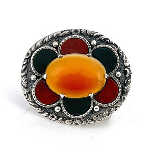 26 - A Scottish hardstone and silver brooch, H Wright and Son, Edinburgh 1966, set with a carnelian agate... 