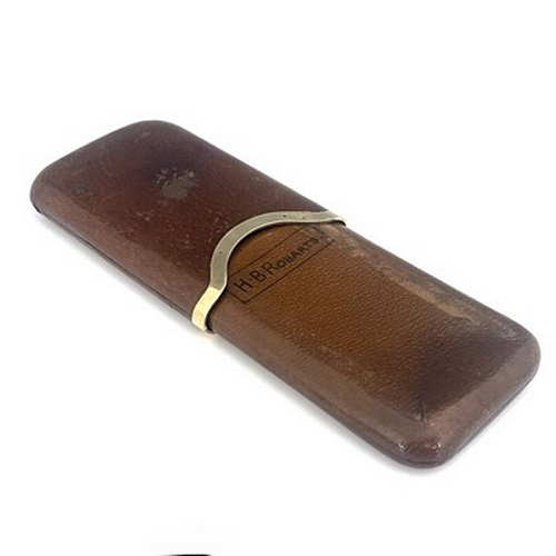 263 - Asprey London, a 9ct gold mounted leather cigar case, London 1917, interior marked H.B. Roberts, 13.... 