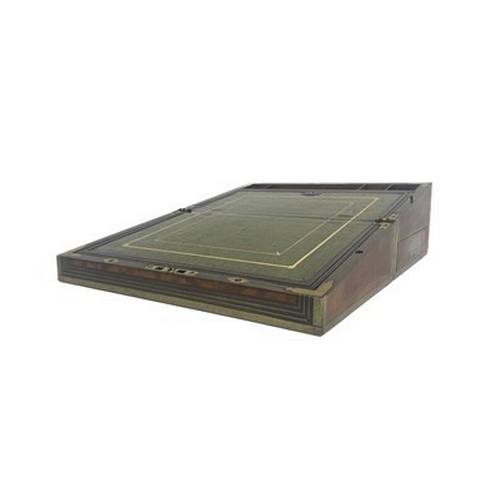 276 - A George III flame mahogany campaign writing slope, circa 1820, brass-bound with a triple strung bor... 