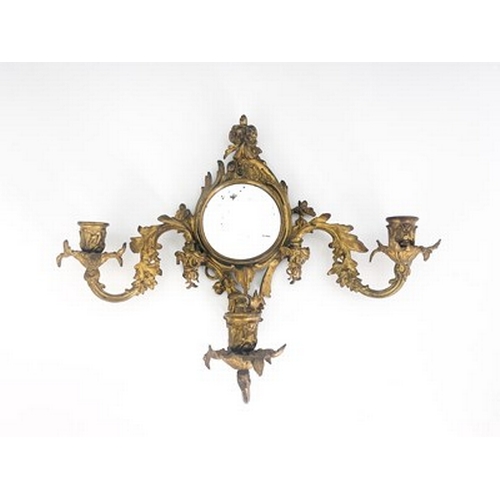 289 - A pair of gilt metal girandoles, late 19th Century, of Rococo design, circular looking glasses, trip... 