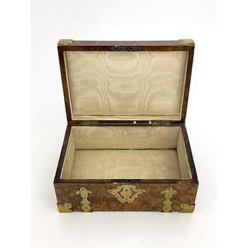 295 - A mid-Victorian burr walnut jewel casket, circa 1860, swing handle, Gothic brass strapwork mounts, a... 