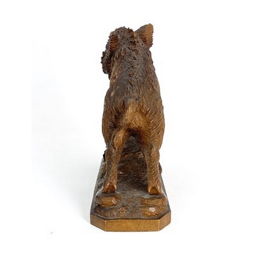 298 - A Black Forest carved wood figure of a boar, 19th century, realistically modelled on a rocky outcrop... 