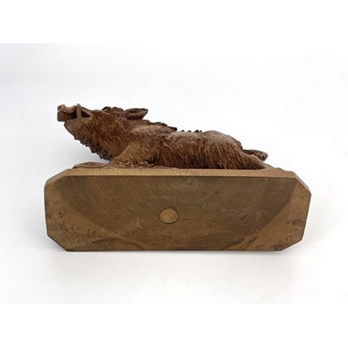 298 - A Black Forest carved wood figure of a boar, 19th century, realistically modelled on a rocky outcrop... 