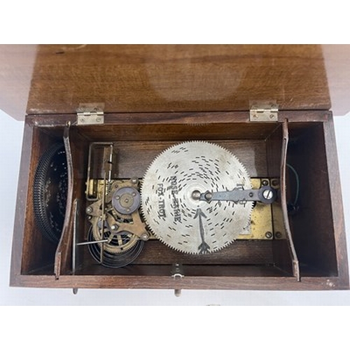 304 - Musical Instruments, a tabletop polyphon, late 19th Century/early 20th Century, wooden case with a p... 