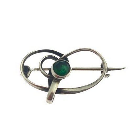 31 - Charles Horner, an Arts and Crafts silver and green gem set brooch, Chester circa 1910, knotted ribb... 