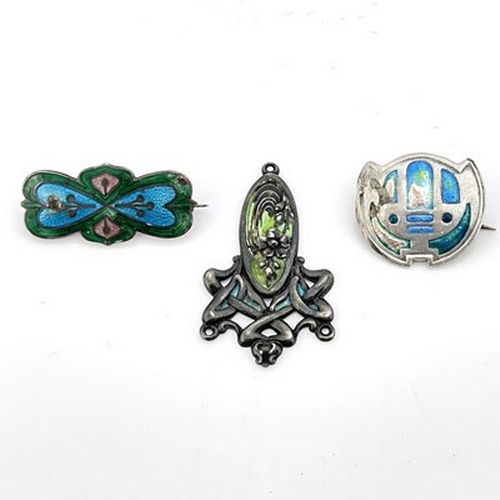 32 - Three Arts and Crafts silver and enamelled brooches and pendant, including Charles Horner and James ... 