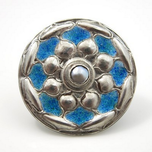 42 - Jessie M King for Liberty and Co., a Cymric Arts and Crafts silver and enamelled brooch, Birmingham ... 