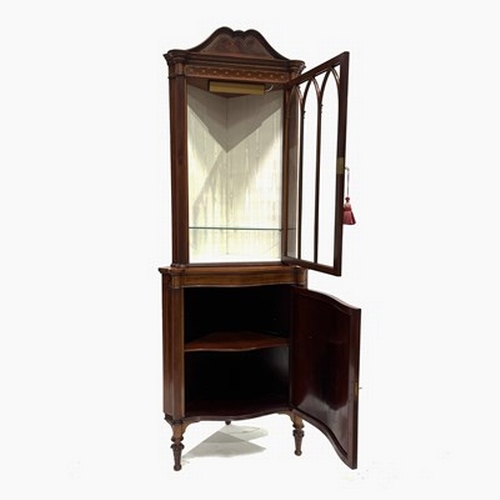 506 - An Edwardian mahogany corner standing vitrine, circa 1910, arched pediment, crossbanded, marquetry i... 