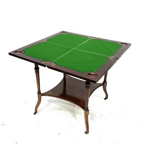 525 - An Edwardian mahogany envelope-action games table, circa 1910, marquetry inlaid, satinwood crossband... 