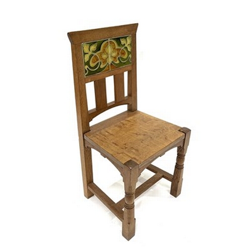 534 - An Arts and Crafts oak and tile chair, possibly Leonard Wyburd for Liberty and Co., turned and chamf... 