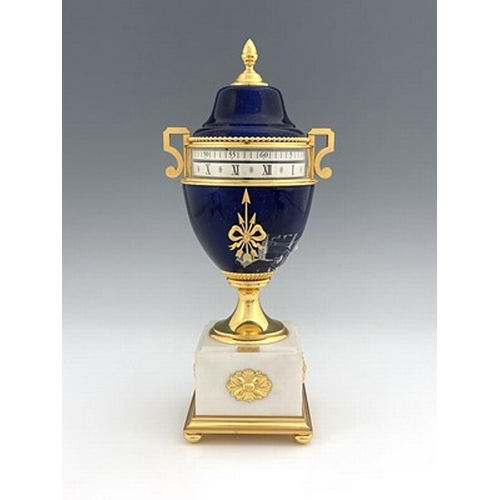 542 - Hour Lavigne, Paris for Garrard, an urn clock of Empire design, lapis lazuli simulated domed lacquer... 