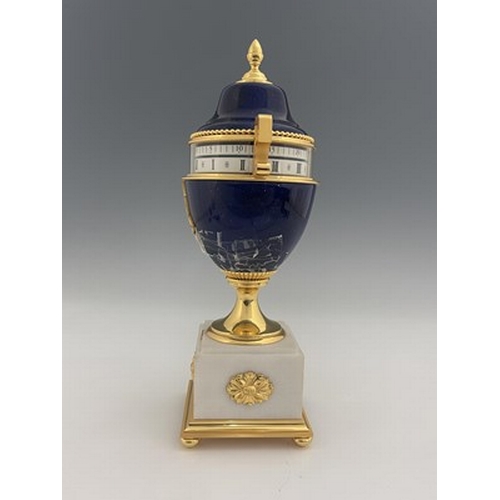 542 - Hour Lavigne, Paris for Garrard, an urn clock of Empire design, lapis lazuli simulated domed lacquer... 