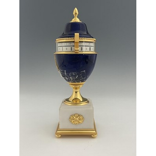 542 - Hour Lavigne, Paris for Garrard, an urn clock of Empire design, lapis lazuli simulated domed lacquer... 