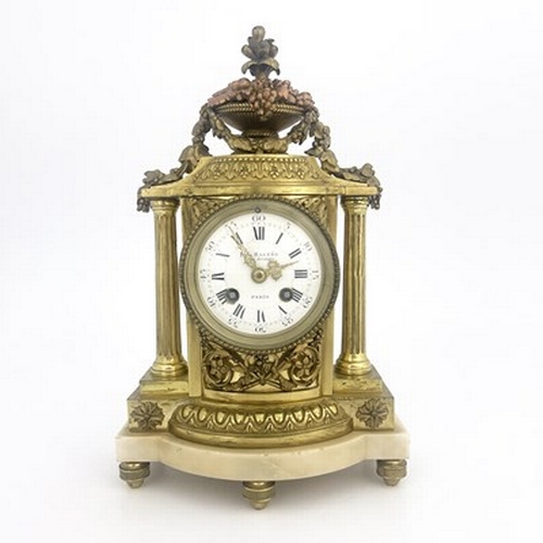 543 - Eug Bagues, Paris, a late 19th Century gilt metal bracket clock, of Baroque design with an urn of fr... 