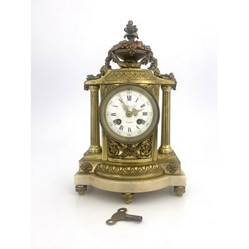 543 - Eug Bagues, Paris, a late 19th Century gilt metal bracket clock, of Baroque design with an urn of fr... 