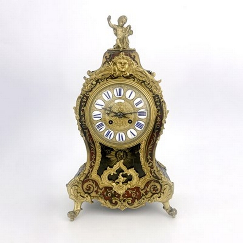 544 - A late 19th Century French boulle work bracket clock, circa 1870, of balloon shape with a cherub fin... 