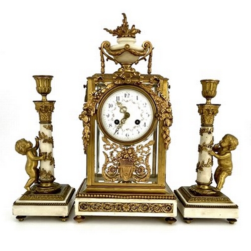 545 - Leroy, Paris, a late 19th Century French clock garniture, gilt metal four-glass case with white marb... 