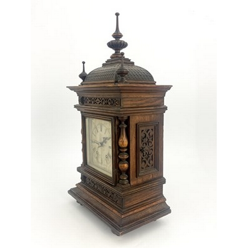 546 - A Black Forest oak bracket clock, late 19th Century, of Germanic architectural form with finials, do... 