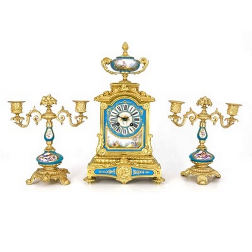 549 - A French porcelain and ormolu mounted clock garniture, circa 1885, the chiming clock movement stampe... 