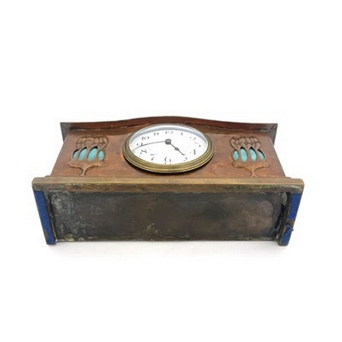 551 - Glasgow School, an Arts and Crafts copper and Ruskin cabochon clock, cuboid plinth form with serpent... 