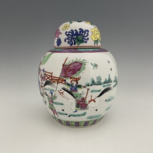 553 - A Chinese famille rose ginger jar, decorated with warriors jousting, with attendants and onlookers, ... 