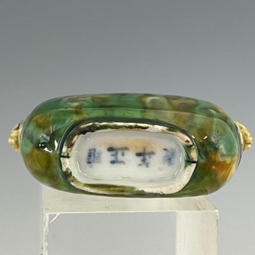 557 - A rare Chinese porcelain snuff bottle, 18th Century, decorated in mottled 'sancai' glazes of yellow ... 