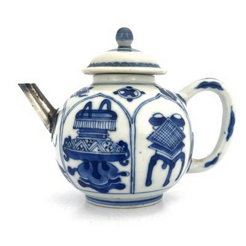 578 - A Chinese blue and white teapot and cover, 18th century probably Kangxi, painted with panels depicti... 