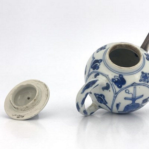 578 - A Chinese blue and white teapot and cover, 18th century probably Kangxi, painted with panels depicti... 