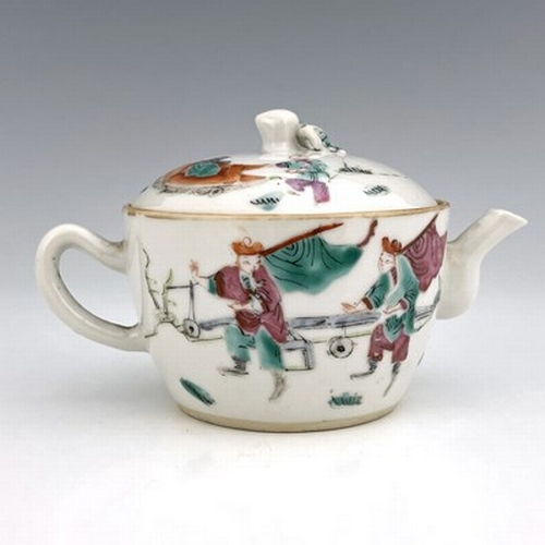 580 - A Chinese famille rose teapot and cover, of small proportions, painted with a deity riding a shishi,... 