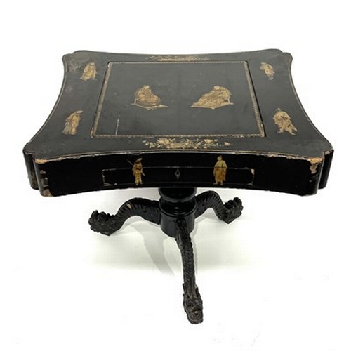 581 - A Chinese black lacquered and gilt games table, Qing Dynasty, inverted top decorated with gilt figur... 