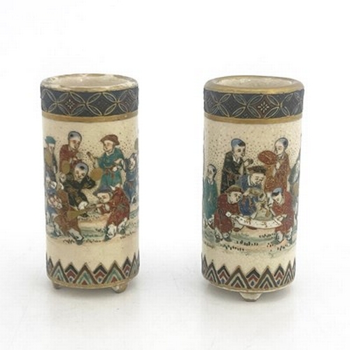 582 - A pair of Japanese Satsuma miniature vases, of cylindrical brush pot form, painted in the round with... 