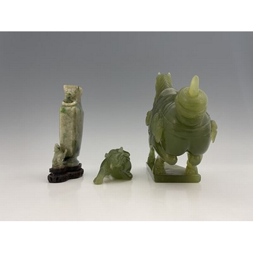 583 - Three Chinese jade type carvings, including a horse, a sushi dog and a ring handled vase on stand, 2... 