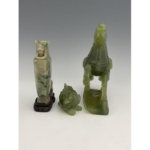 583 - Three Chinese jade type carvings, including a horse, a sushi dog and a ring handled vase on stand, 2... 