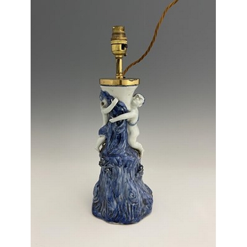 584 - A Chinese blue and white figural lamp, modelled as two boys climbing a gnarled tree trunk, 40cm high