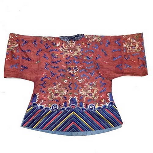 598 - A Chinese silk embroidered skirt and overcoat, Qing Dynasty, 19th Century, the overcoat in red with ... 