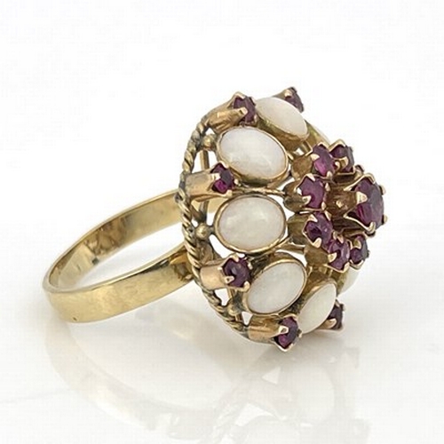 6 - An 18k gold opal and ruby cluster ring, ring size Q 1/2, 5.8g