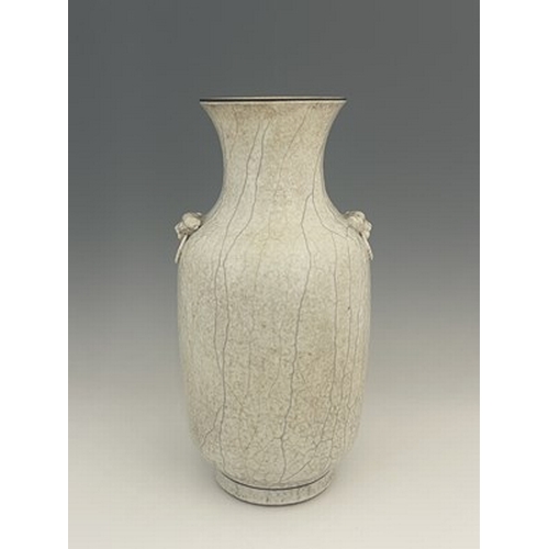 605 - A Chinese twin handled vase, shouldered rouleau form, white oatmeal textured craquelure glaze with r... 