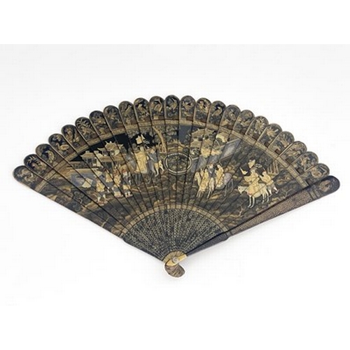 608 - A Chinese lacquered brise fan, Canton, Qing dynasty, rounded top and tapering guards, decorated in g... 