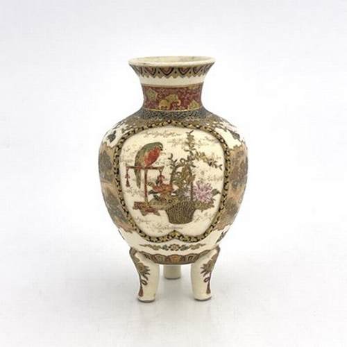 623 - A Japanese Satsuma vase, Meiji, shouldered ovoid form on three legs, painted with two vignettes of w... 