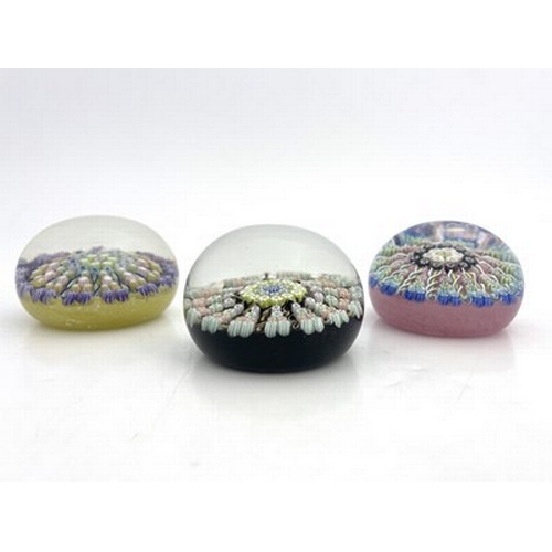 638 - Perthshire, three millefiori glass paperweights, pre 1978, opaque yellow, black and pink grounds, ea... 