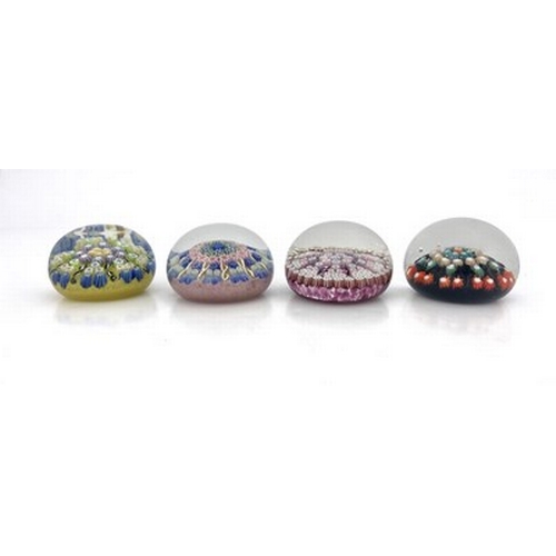 639 - Perthshire and Scottish, four medium sized millefiori glass paperweights, pre 1978, three with flora... 