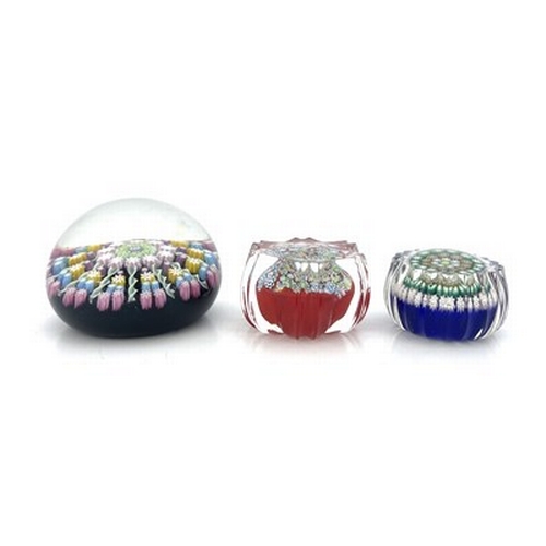 641 - Perthshire and Peter McDougal, three millefiori glass paperweights, including two miniature concentr... 