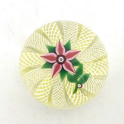 643 - Paul Ysart for Harland, a floral glass paperweight, the five petal pin flower on a cushioned ground ... 