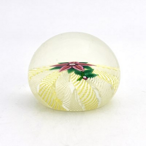 643 - Paul Ysart for Harland, a floral glass paperweight, the five petal pin flower on a cushioned ground ... 