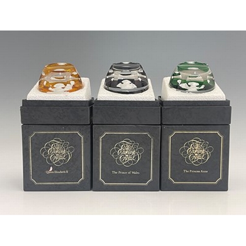 644 - Three Baccarat commemorative glass paperweights, 1976, including the Prince of Wales, Elizabeth II a... 