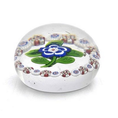 645 - Baccarat, a small floral and millefiori glass paperweight, 19th century, the central blue and white ... 