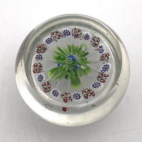 645 - Baccarat, a small floral and millefiori glass paperweight, 19th century, the central blue and white ... 