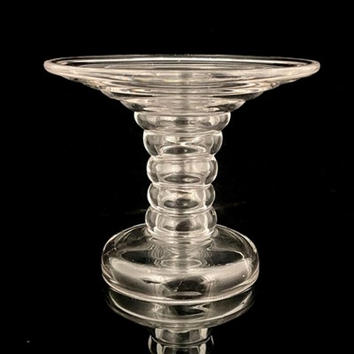 651 - An 18th century ribbed glass ham stand, circa 1790, trumpet form with multi knopped shaft, domed foo... 